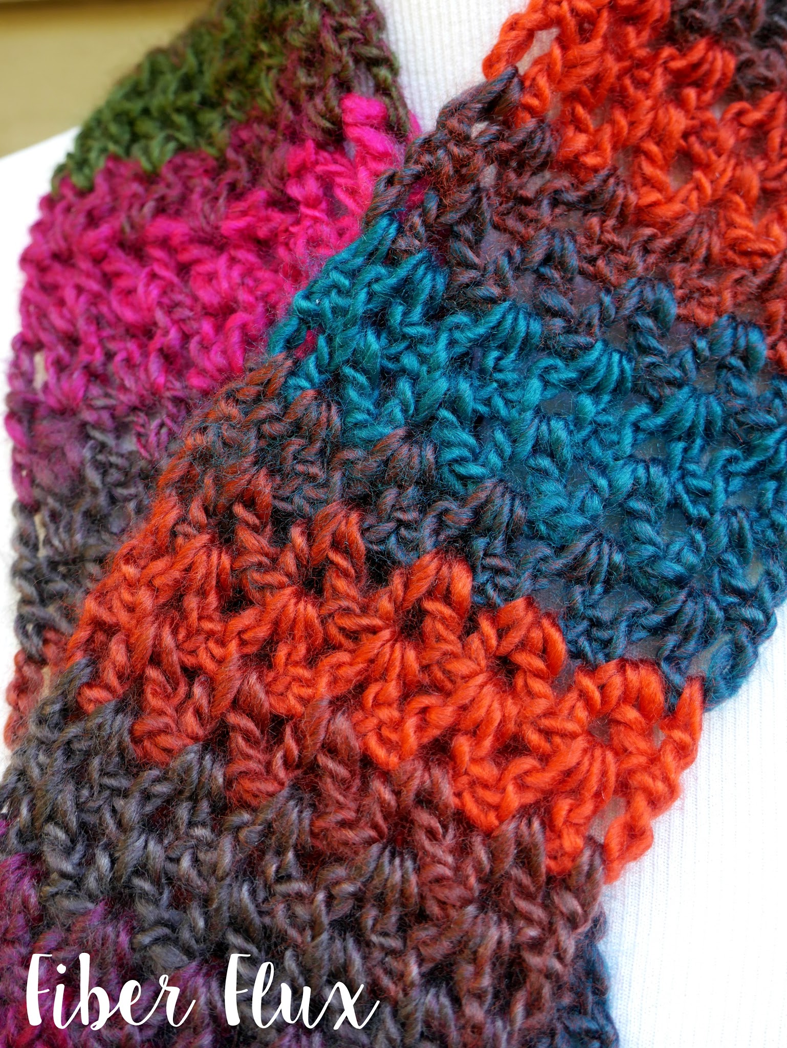 closeup of the autumn gems button scarf crochet striped scarf